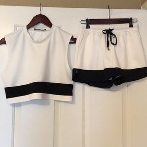 Esther Penn white/ black crop top and shorts set.